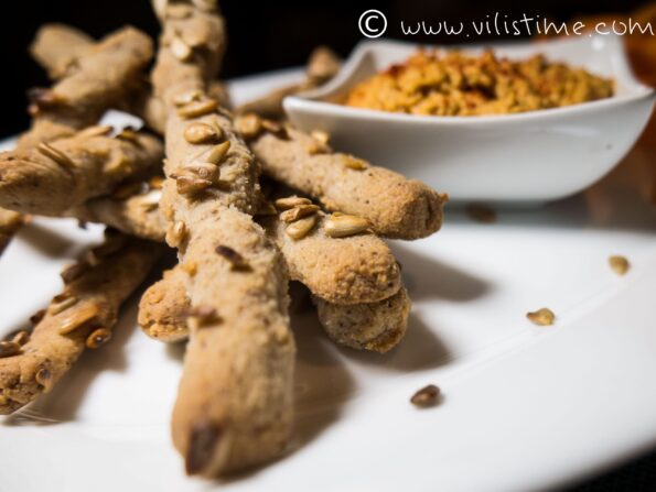 Homemade hummus with crispy rice sticks